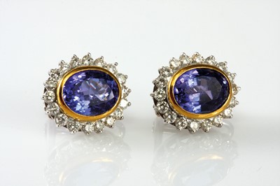 Lot 17 - 18ct white and yellow gold pair of oval shape cluster tanzanite and diamond earrings