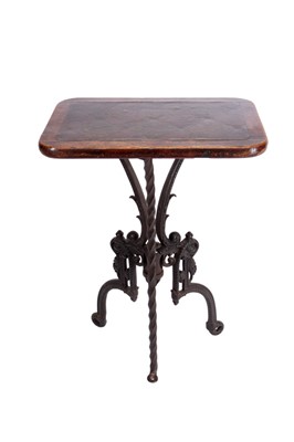 Lot 33 - An oak and cast-iron table
