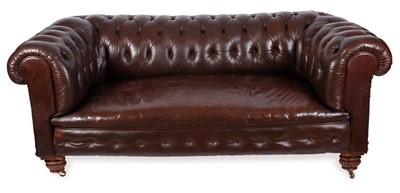 Lot 63 - A Victorian Chesterfield sofa upholstered in tufted brown leather