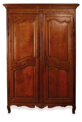 Lot 67 - A French provincial style fruitwood armoire