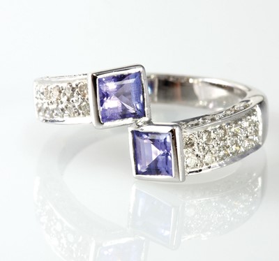 Lot 7 - 14ct white gold fifty stone tanzanite and diamond crossover design dress ring