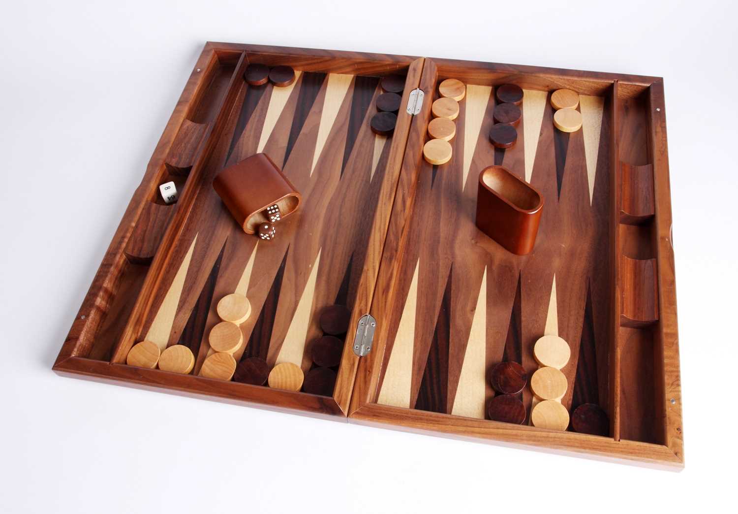 Lot 105 - An iridescent wood backgammon set
