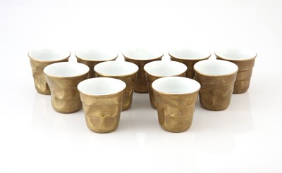 Lot 126 - Eleven Revol gold porcelain crumple espresso cups