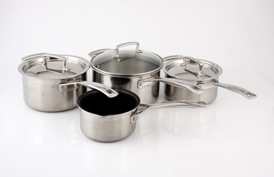 Lot 153 - Four Le Creuset stainless steel sauce pans