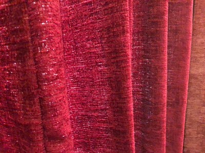 Lot 184 - A pair of red crushed velvet curtains with matching pelmet