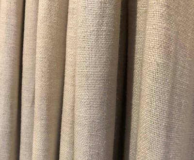 Lot 187 - A pair of cream linen curtains with matching pelmet