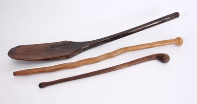 Lot 81 - An earthenware vessel, two wooden 'knopkieries' and a wooden oar
