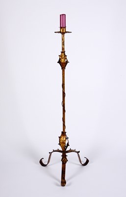 Lot 84 - A gilt metal candle stand on a scrolling tripod base