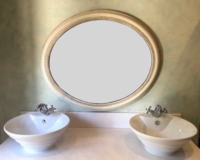 Lot 85 - A white painted oval wall mirror