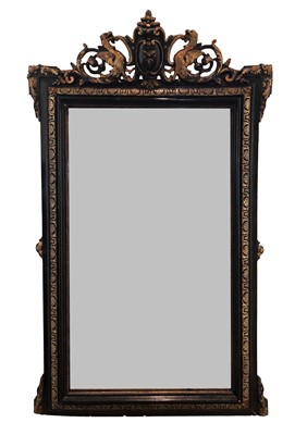 Lot 89 - A carved and parcel gilt wall mirror