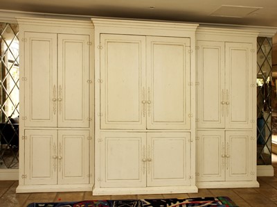 Lot 94 - A cream painted-wood breakfront cabinet