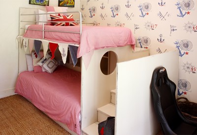 Lot 98 - A white-painted Future Classics wood and metal two-tiered children's bunk bed