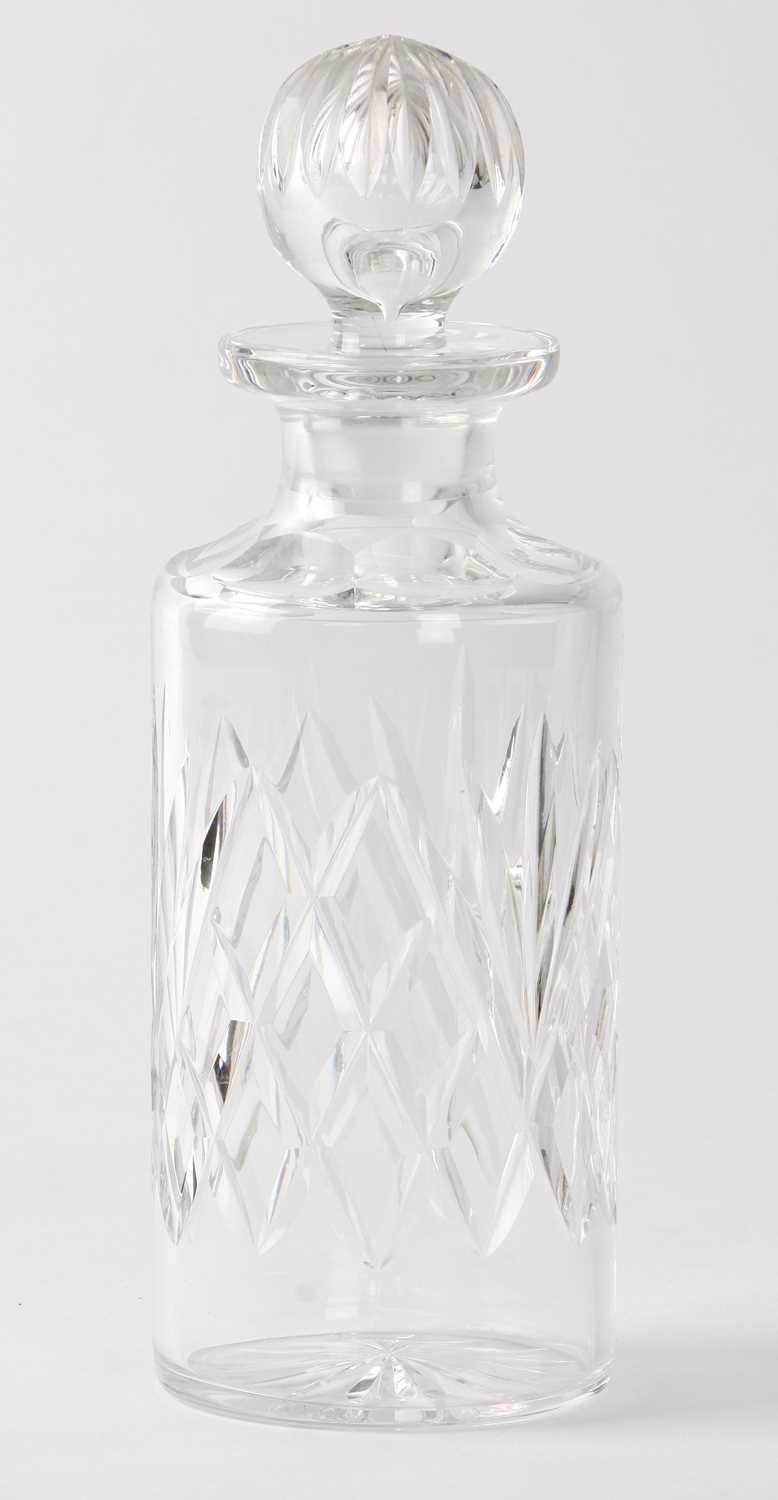 Lot 13 - ,A modern clear glass cylindrical decanter, cut with fan and lattice band and clear glass globular stopper cut with splits