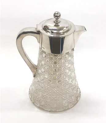 Lot 19 - ,A 19th century cut glass lemonade decanter with silver mounts and inner stoppered container for ice