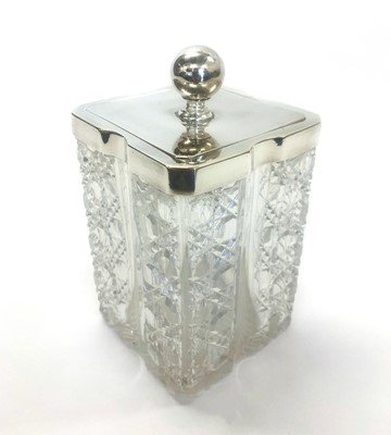 Lot 20 - ,A late 19th century clear glass biscuit barrell with lattice cutting, star cut base and attached silver mounted lid