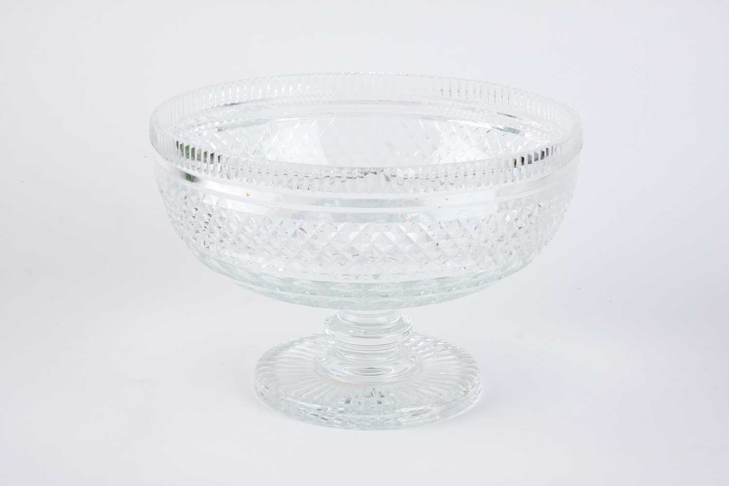 Lot 21 - ,A modern clear cut glass punch bowl cut with lattice and printies bands on a spreading foot with cut patterened base