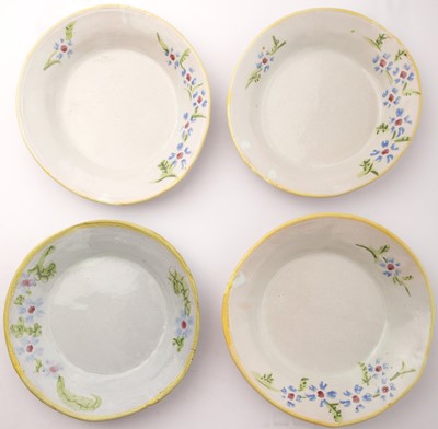 Lot 41 - Hylton Nel,A set of four plates with flowers